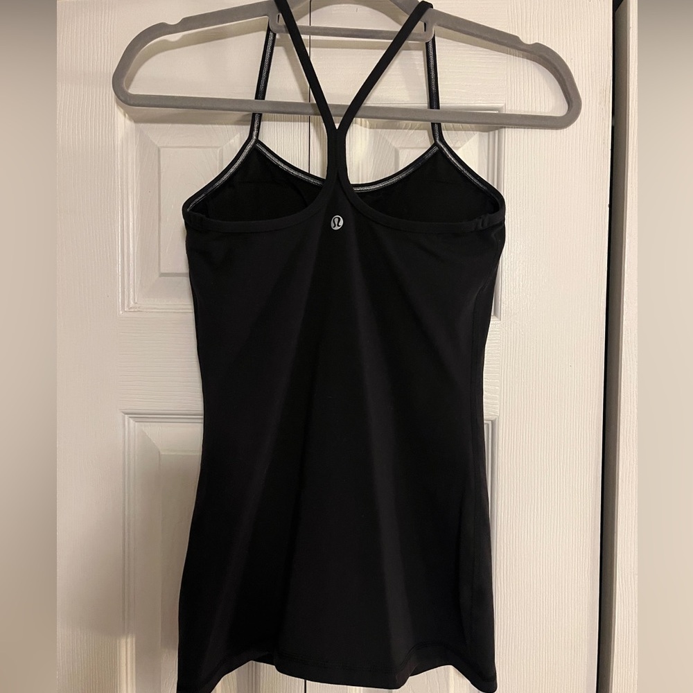 Black tank top with built in bra with pads.